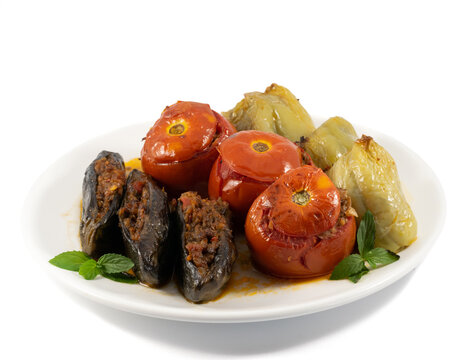 Traditional Azerbaijan food Dolma. Uc baci, Pomidor badimcan biber dolmasi. Tomatoes, eggplants and peppers filled with meat