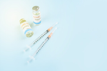 Covid-19 Corona Virus 2019-ncov vaccine vials medicine drug bottles syringe injection. Vaccination, immunization, treatment to cure Covid 19 Corona Virus infection.