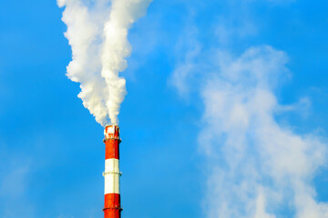 smoke is coming from industrial pipes