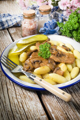 Braised pork loin with mushrooms.