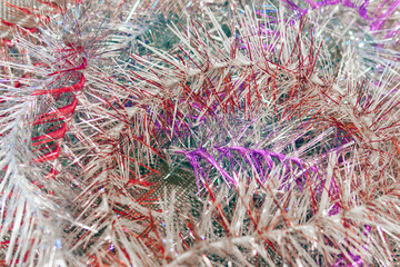 Christmas toys and tinsel are in a retro suitcase