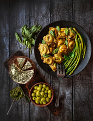 ravioli with spinach and ricotta cheese. Parmesan cheese. in a plate. Top view