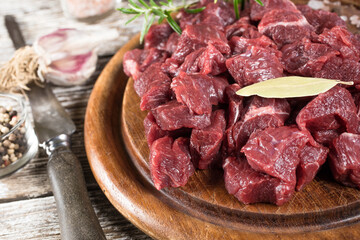 Beef stew prepared on a chopping board.