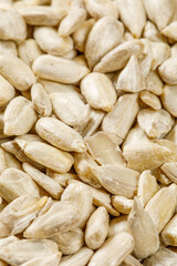 close up of sunflower seeds in a  spoon