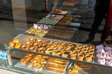 Shop window with pastry shop pastries through glass