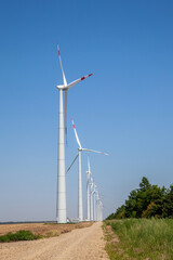 wind turbines on cloudy blue sky background