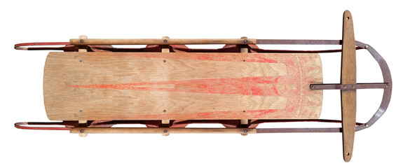 Vintage, faded wooden sled with metal runners. Isolated.