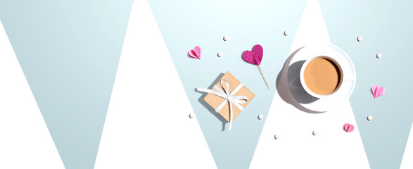 A cup of coffee with a gift box and hearts - flat lay