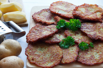 Potato pancakes on a wooden board