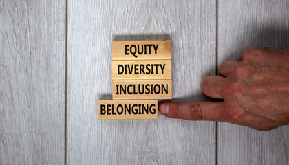 Equity, diversity, inclusion and belonging symbol. Wooden blocks with words 'equity, diversity,...