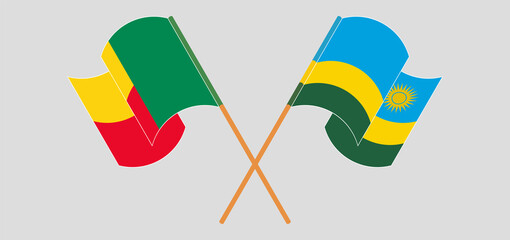Crossed and waving flags of Benin and Rwanda