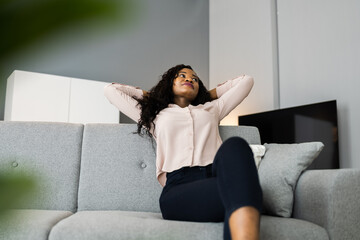 Young African Woman On Sofa