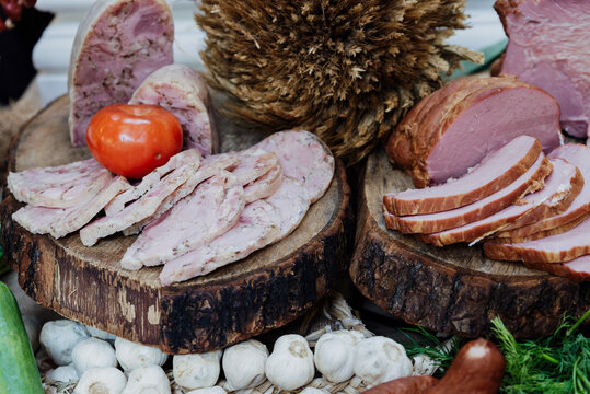 village table - ham, headcheese and sausage on wood