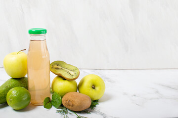 fresh green fruit juice in a glass bottle, apple