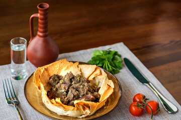 Appetizing meat in baked lavash according