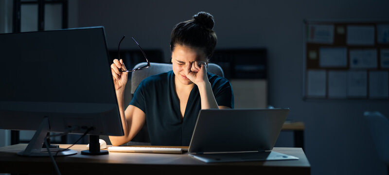 Woman With Dry Tired Eyes Working Late At Night