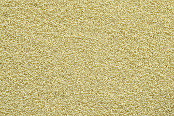 Couscous groats texture as a background. Full frame of couscous grains
