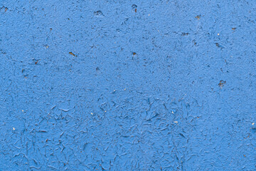 the wooden background is painted blue, the aged paint is peeling off