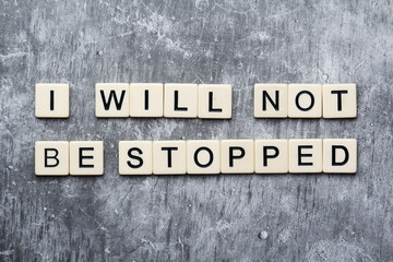 The phrase I will not be stopped formed with tiles