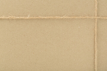 box packed in brown craft paper and tied with twine