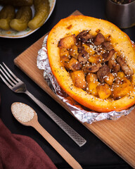 Pumpkin stuffed with meat and vegetables. Healthy eat concept.