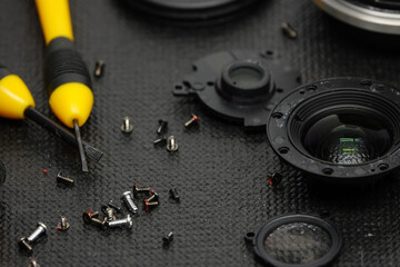 lens repair with yellow screwdriver, repair concept