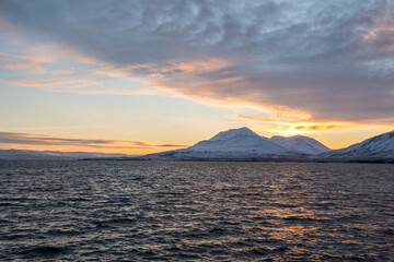 Naklejka na ściany i meble Beautiful sunset of island of Hrisey in Iceland