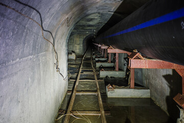 Dark vaulted underground urban sewer tunnel system