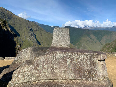 Sacred Inca Intihuatana stone or Hitching Post of  Sun in Machu Picchu ruins Peru. Place to tie up Sun. Ancient  monument Intiwatana is ritual stone. Astronomic clock or calendar of Inca.