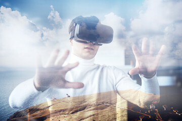 travels in virtual reality. I put 3D glasses on my face. modern digital technologies are available. the programmed world in the game. the male programmer is dark-haired.