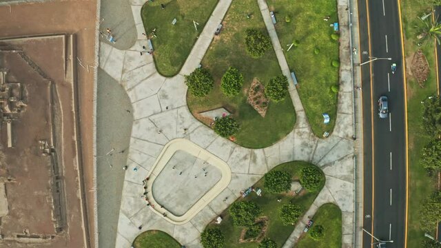Lima, Peru - February 05, 2021: Aerial view of Huaca archeological site in San Miguel disctrict. Ancient pre-inca ruins in the middle of an urban city.
