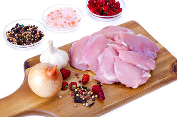 Fresh raw pink eco chicken fillet for cooking on white plate. Studio Photo
