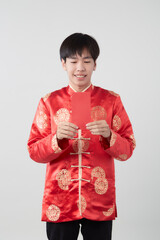 Chinese man with mandarin holding red envelope