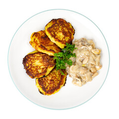 Fried grated potato pancakes with mushroom sauce. Studio Photo