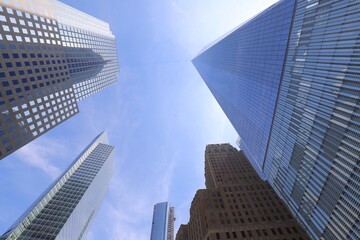 Fototapeta na wymiar Low Angle View Of Modern Buildings Against Blue Sky