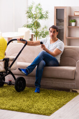 Young male contractor looking after new born at home