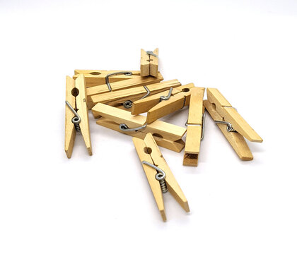clothespins. wooden clothespins on a white background side view