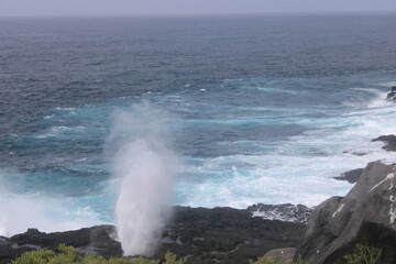 waves crashing on rocks