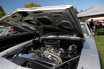 An Under the Hood Side View of Restored Vintage Automobile Engine with Show-Chrome Air Filter