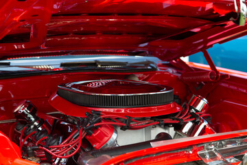 An Under the Hood Side View of Restored Vintage Automobile Engine with Show-Chrome Air Filter