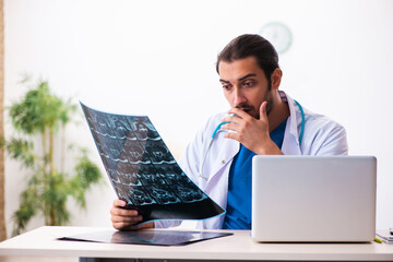 Young male doctor radiologist working in the clinic