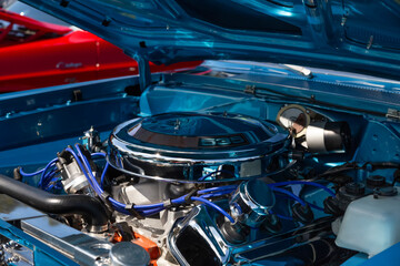 An Under the Hood Side View of Restored Vintage Automobile Engine with Show-Chrome Air Filter
