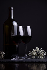 Red wine and two glasses for a romantic date night