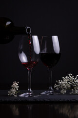 Red wine and two glasses for a romantic date night