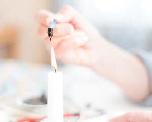 Hand and Candle with Kistka Pysanky Easter