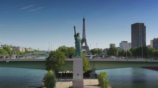 paris city river island statue of liberty monument traffic bridge tower district aerial panorama 4k france