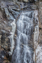 Fototapeta na wymiar cascading waterfall over rocky cliff