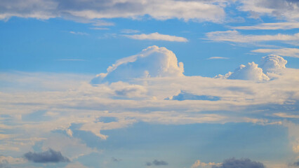 Puffy clouds in the blue sky