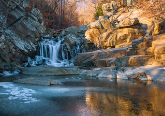 Partially frozen Scott's Run waterfall in the morning.Scott's Run Nature Preserve.Fairfax County.Virginia.USA