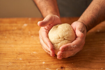 cook kneads his preparation before baking